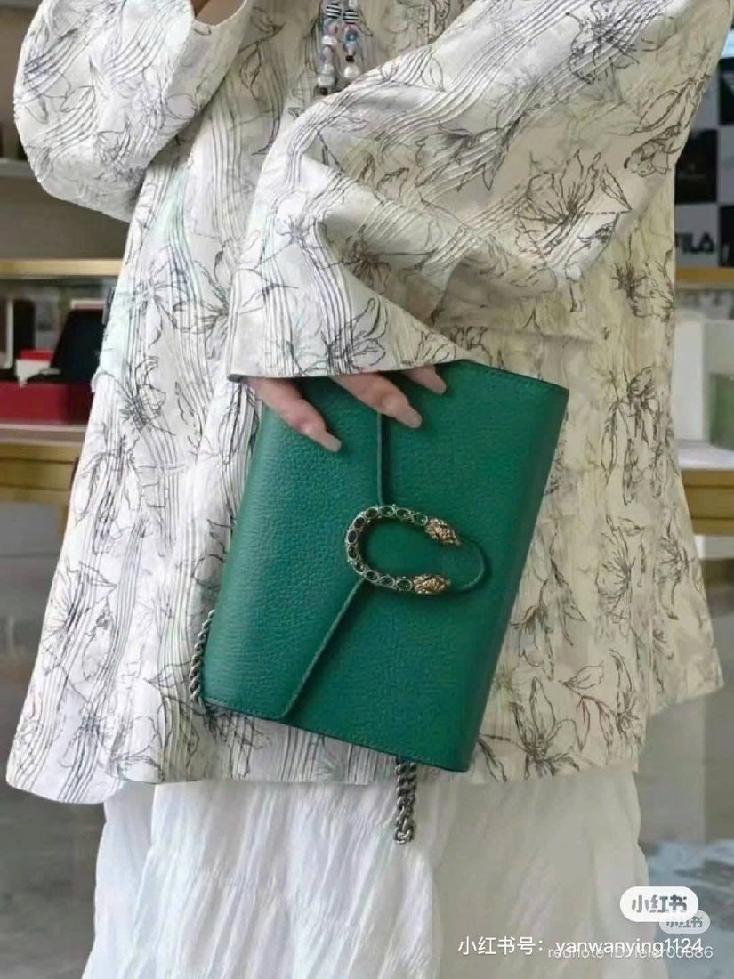Gucci Dionysus in emerald green leather worn over the shoulder