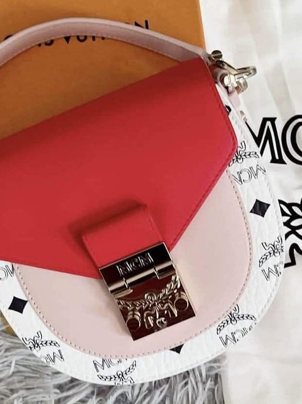 MCM Patricia flap bag in red and white leather with its patterned dust bag