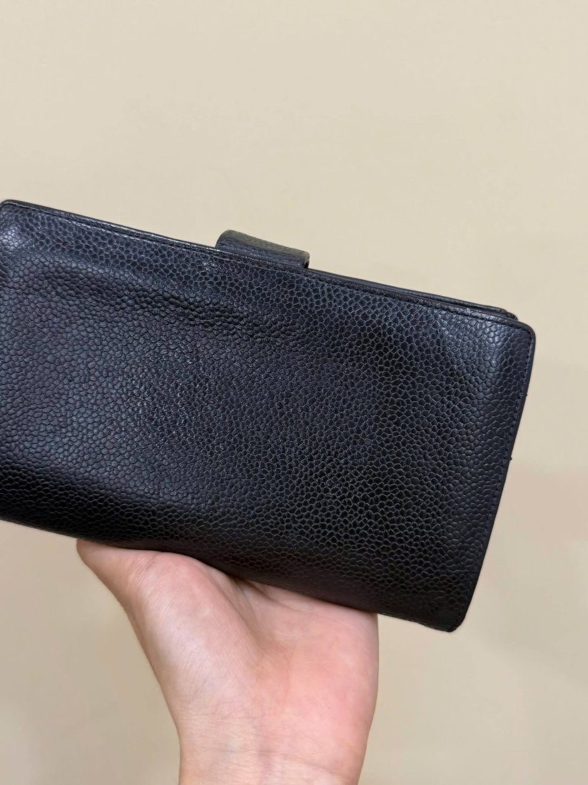 Navy long wallet in textured leather, shown closed and open