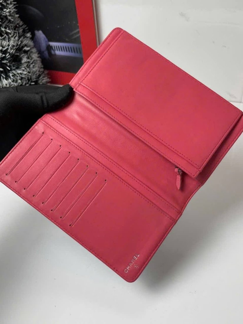 Red compact folding wallet shown open and in profile