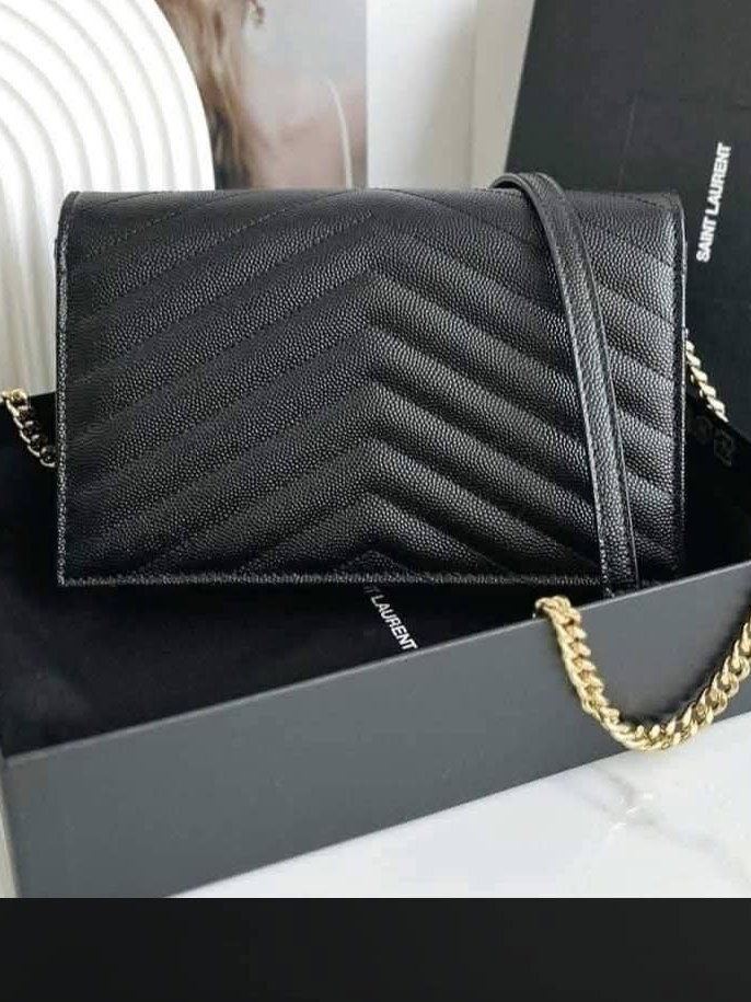 Saint Laurent Envelope Chain Wallet in black grain de poudre leather with gold hardware, shown with its box and dust bag